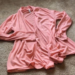 Soft peachy colored cardigan